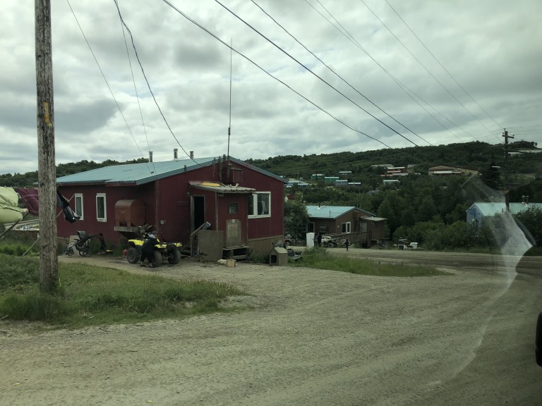 Power lines connecting to buildings across the mountains