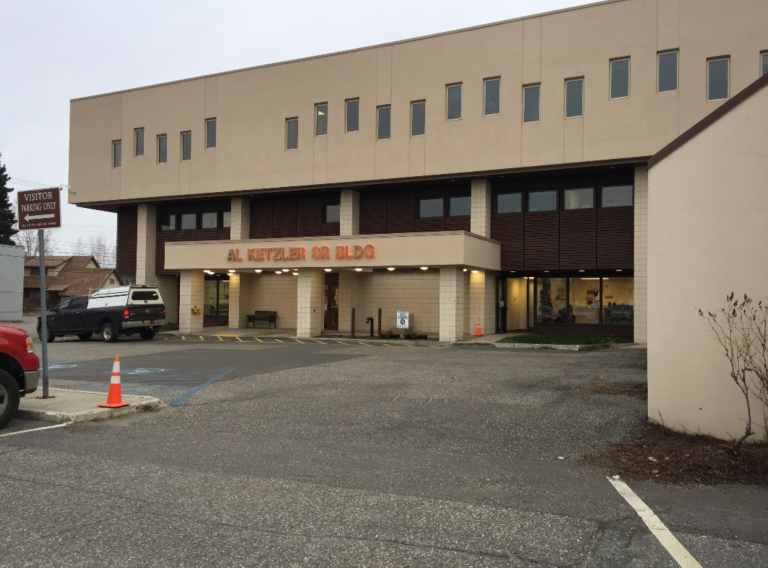 Multistory concrete building with windows in a wave pattern