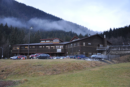 Wooden slab multistory building on wooded mountain